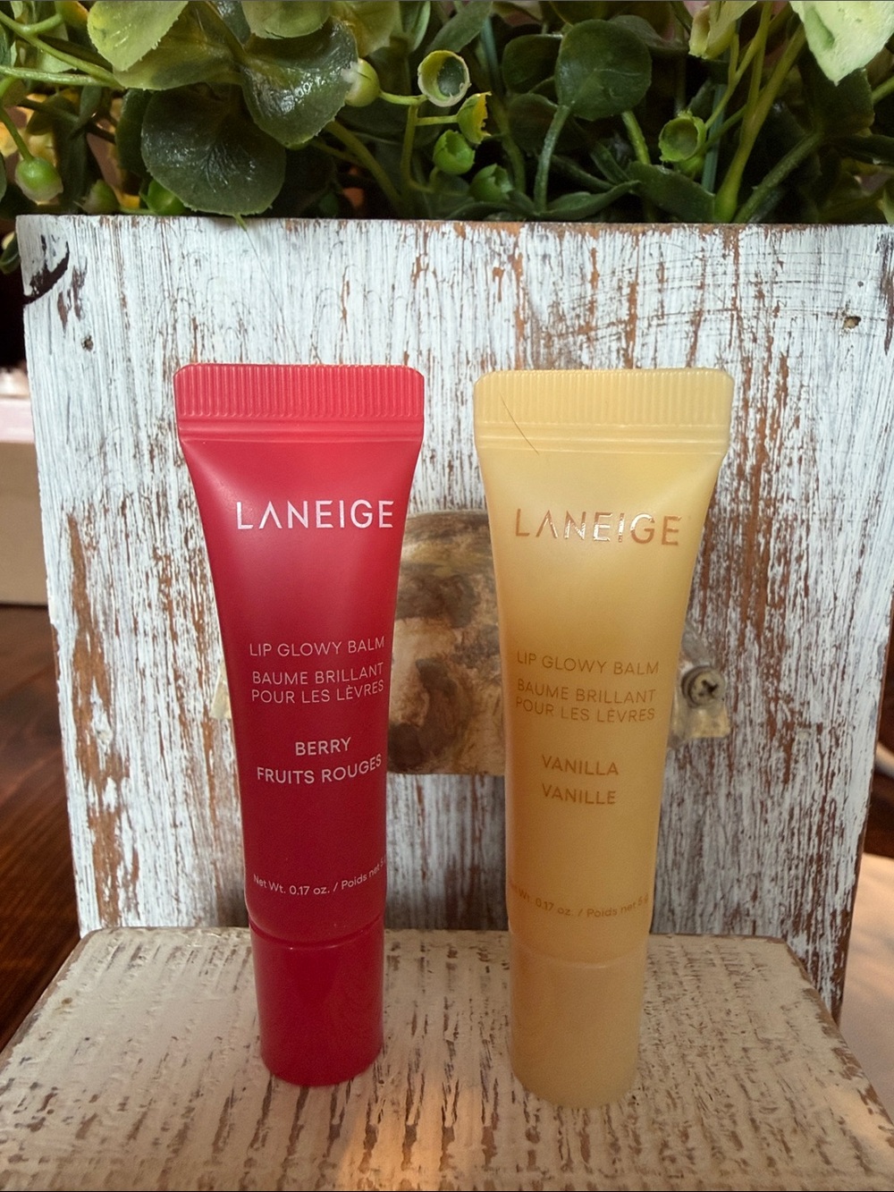 LANEIGE Lip Glowy Balm Duo — Berry (Red) & Vanilla (Cream) travel sizes.